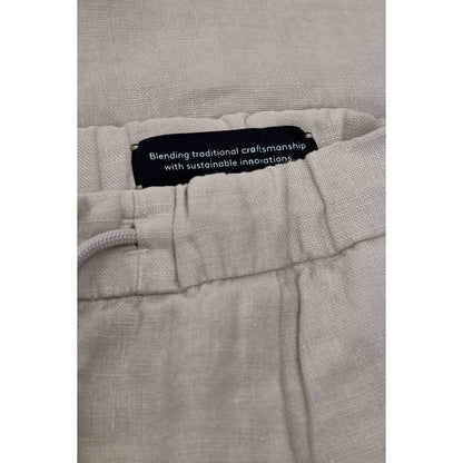 Men's Vigo tapered linen pants in mud grey by Closed Men's, featuring a relaxed fit and tapered leg design.