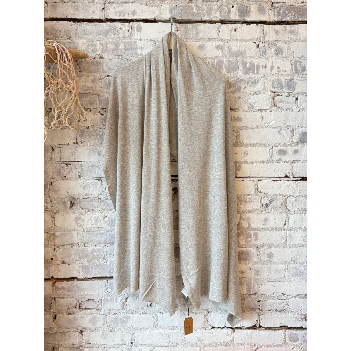 Women's washable cashmere shawl in Brume Chine color by Majestic Filatures, draped to showcase soft, lightweight fabric and elegant style.
