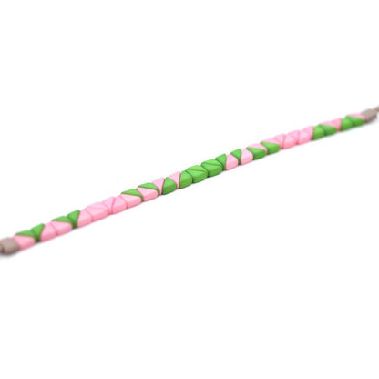 Julie Rofman Watermelon Wedge bracelet, colorful accessories with watermelon-inspired design featuring vibrant wedge-shaped charms.