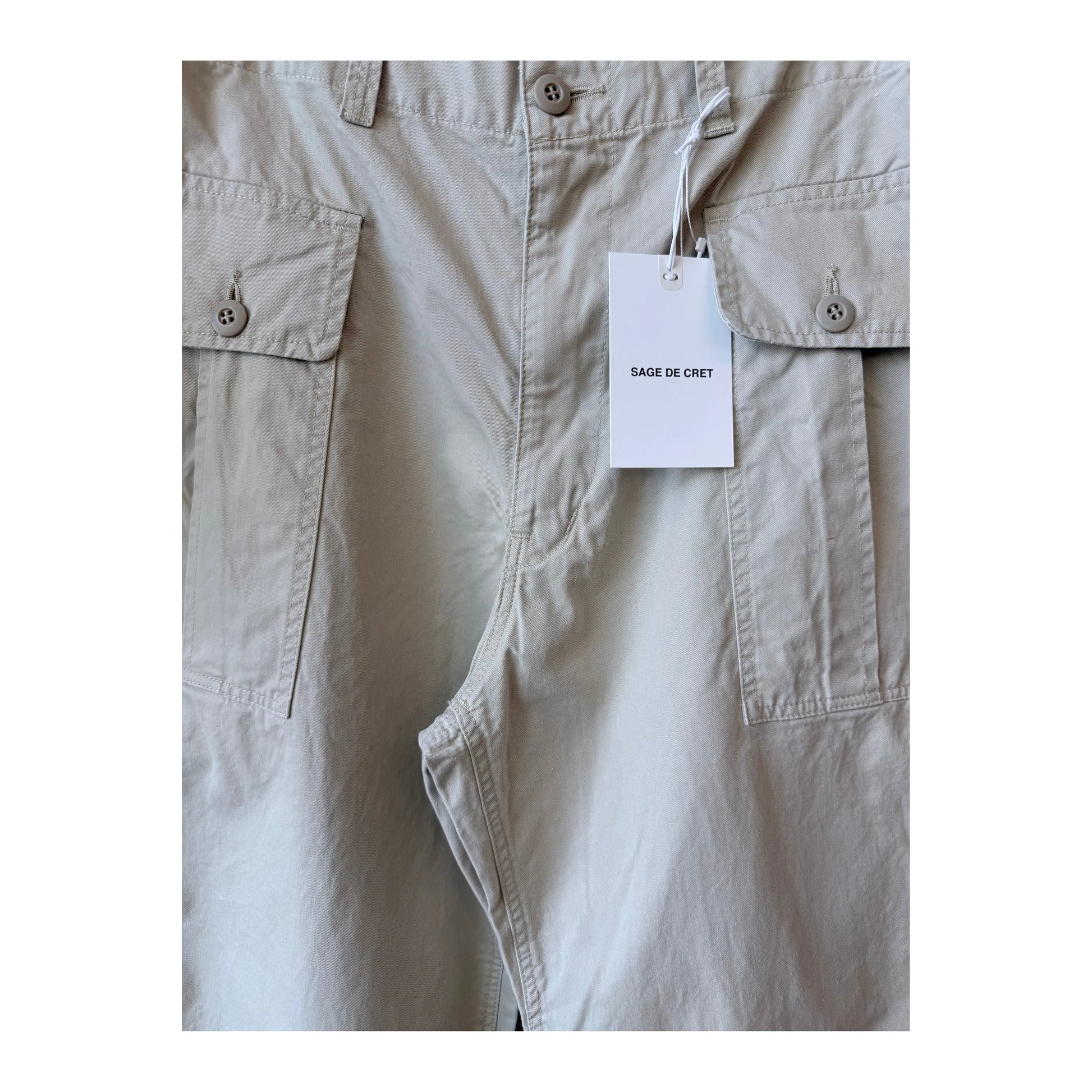 Men's beige Sage De Cret wide chino cloth cargo pants with multiple pockets, relaxed fit, and casual style.
