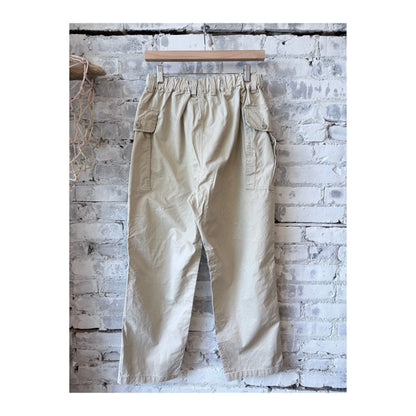 Men's beige Sage De Cret wide chino cloth cargo pant with multiple pockets and relaxed fit, front view showing fabric texture.