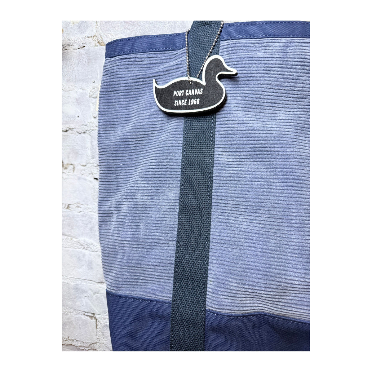 Women's blue wide wale cord utility tote bag by Save Khaki United with sturdy handles and spacious interior.