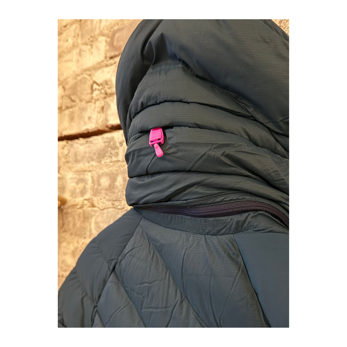 Women's Wildpuff Packable Removable Hood Jacket by Seniq in Slushi color, shown with its lightweight, packable design and removable hood.