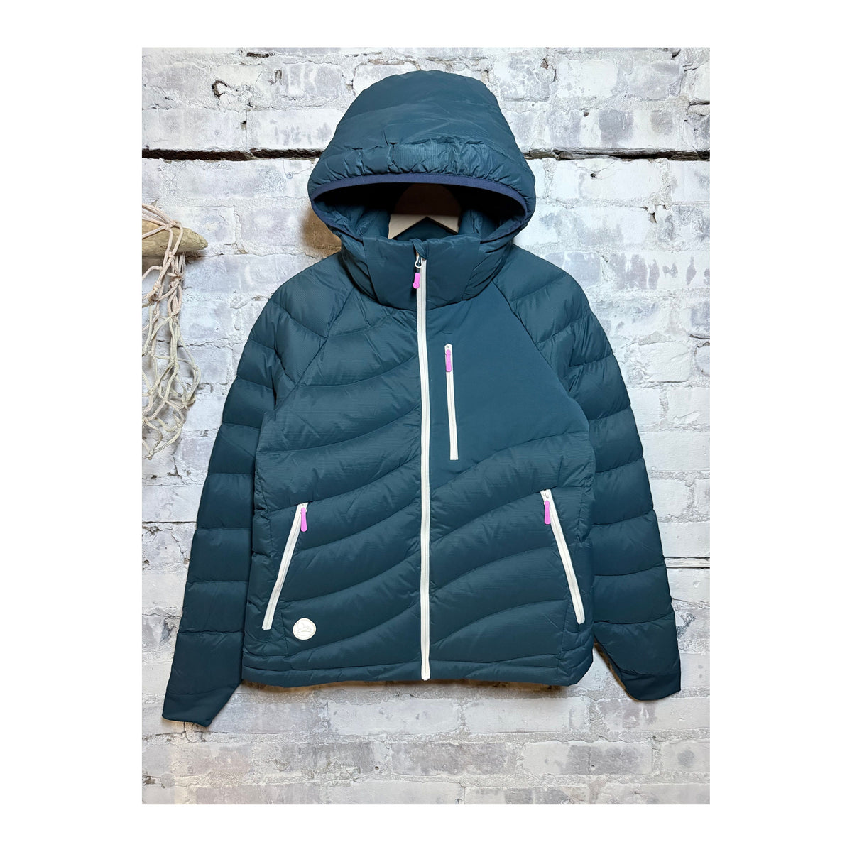Women's Wildpuff Packable Removable Hood Jacket by Seniq in Slushi color, showing the lightweight, insulated design with removable hood.
