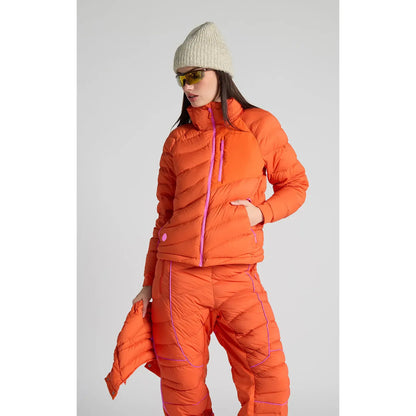 Women's Wildpuff Packable Removable Hood Jacket by Seniq, in spicy color, shown with lightweight, insulated design and removable hood.