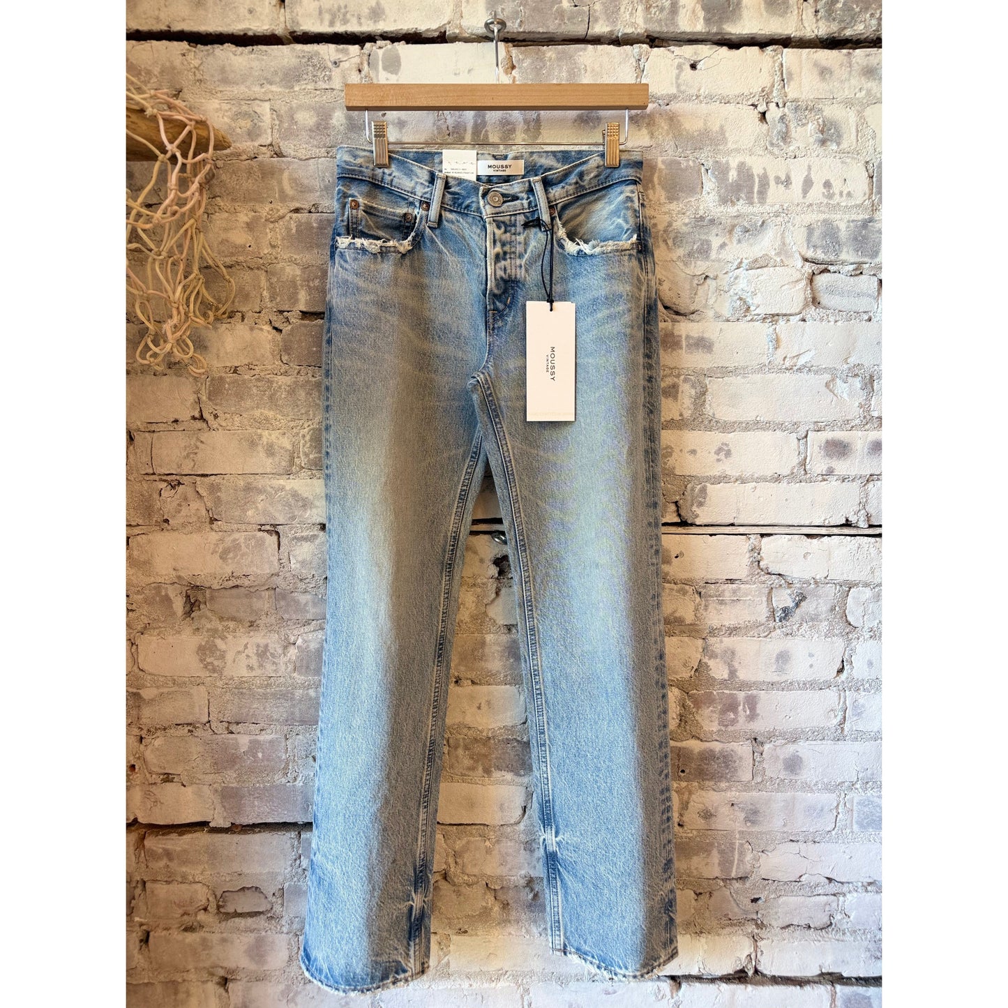 Light blue Moussy Wildwood Straight Low women's jeans displayed on a model, showcasing a relaxed fit and casual style.