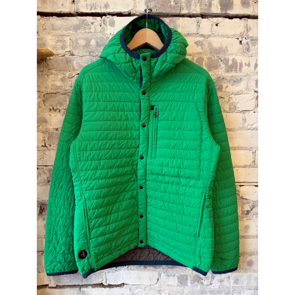Men's Kelly green Windzip Hood by Relwen, featuring a lightweight windbreaker with zipper front and adjustable hood.