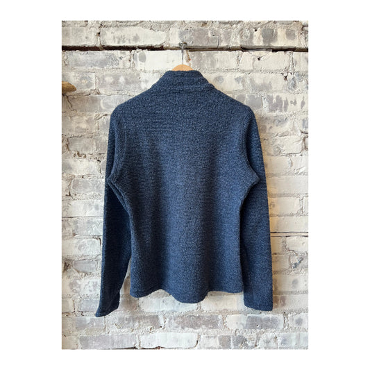 Women's Amundsen Hut Half Zip in faded navy, featuring a high collar and half-zip design, laid flat with textured fabric details.