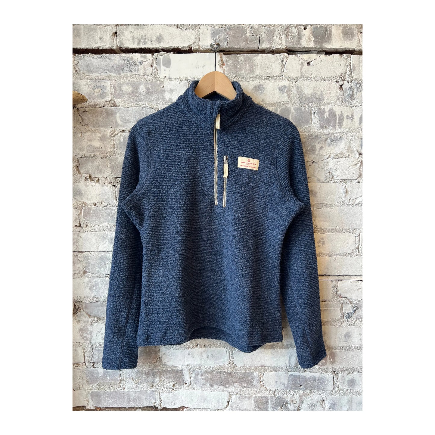 Women's Amundsen Hut Half Zip in faded navy, showing the soft fabric and half-zip design, perfect for casual outdoor wear.