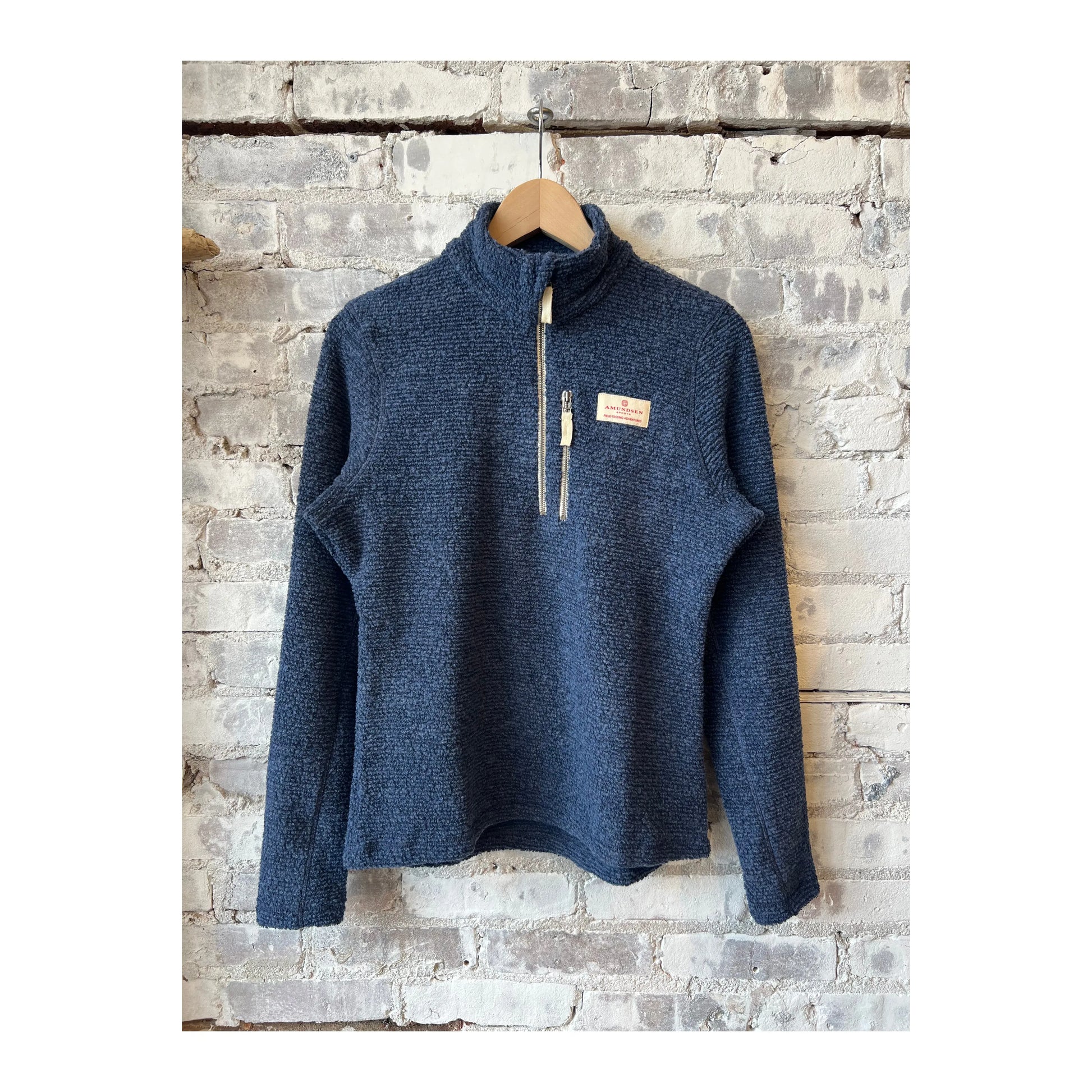 Women's Amundsen Hut Half Zip in faded navy, showing the soft fabric and half-zip design, perfect for casual outdoor wear.