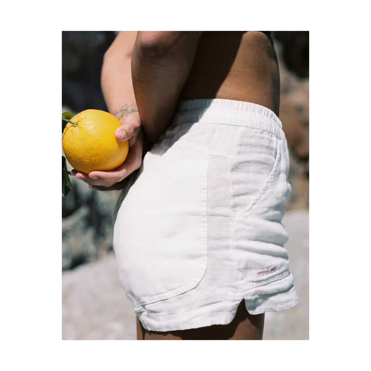 Women's safari linen shorts in faded peony pink by Amundsen, featuring a relaxed fit and lightweight fabric.