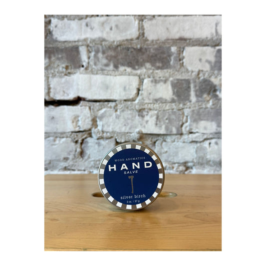 Silver Birch Hand Salve by Wood Aromatics in a sleek metal tin, showcasing natural ingredients and a calming, woodsy scent.