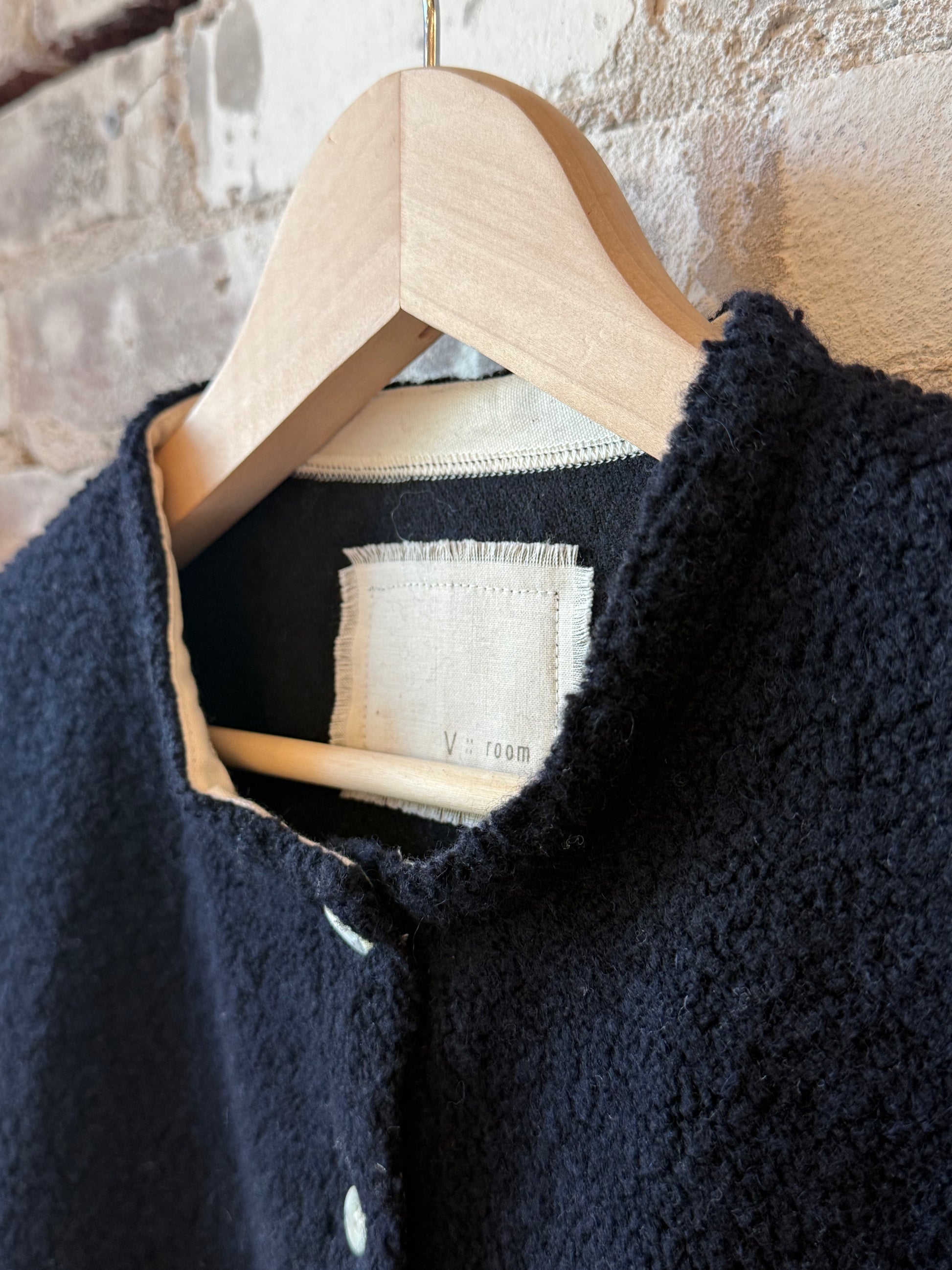 Women's navy Wool Boa Fleece Jacket by V::Room, showing the cozy fleece fabric and stylish collar detail.