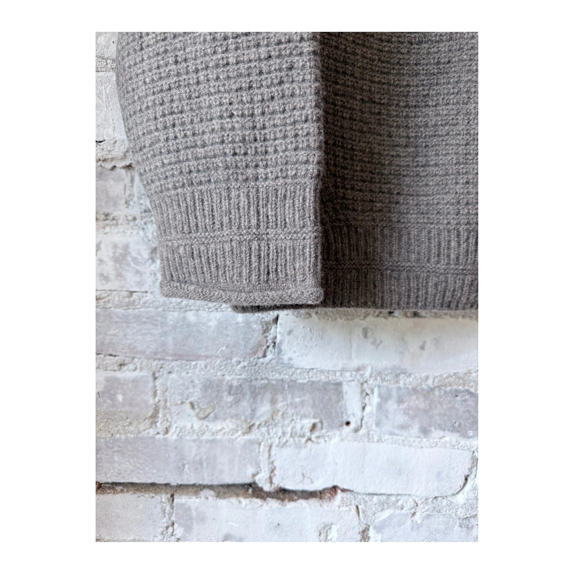 Women's wool cashmere pullover in greige by Pas De Calais, showcasing a soft, cozy knit with a relaxed fit and subtle texture.