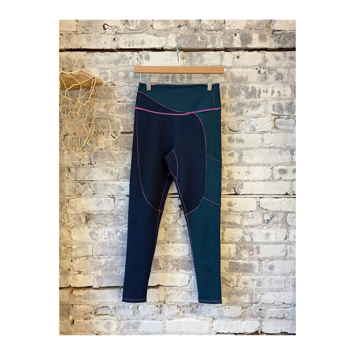 Women's Wool Sculpt Merino Baselayer Leggings by Seniq, close-up of soft, fitted black leggings with seamless design.