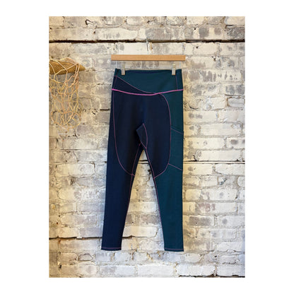 Women's Wool Sculpt Merino Baselayer Leggings by Seniq, close-up of soft, fitted black leggings with seamless design.