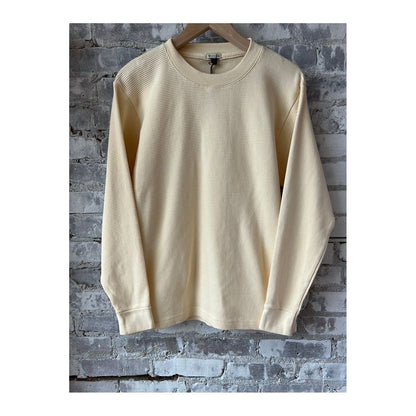 Men's cream cotton longsleeve thermal shirt by Wythe, featuring a soft fabric and casual fit for comfortable layering.