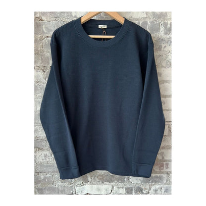 Men's navy cotton long-sleeve thermal shirt by Wythe, showing the soft fabric and classic fit for cold weather.