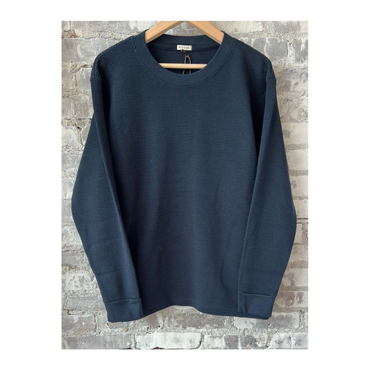 Men's navy cotton longsleeve thermal shirt by Wythe, showing the soft fabric and casual fit.