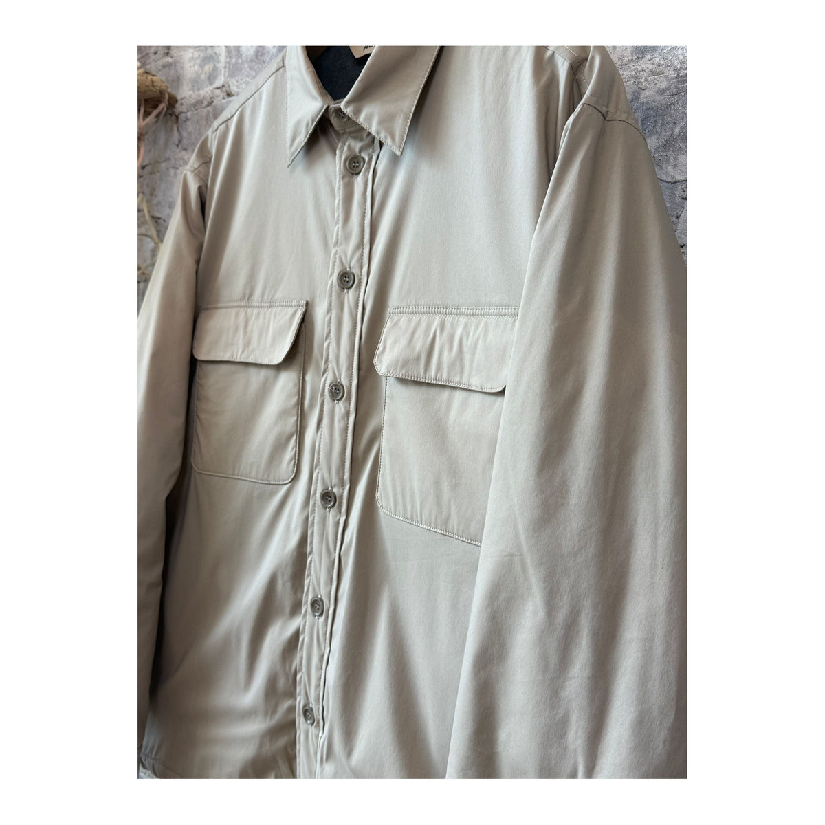 Men's Yoshitaka cotton nylon shirt jacket in colonial beige by Aspesi, shown with collar and front button closure.