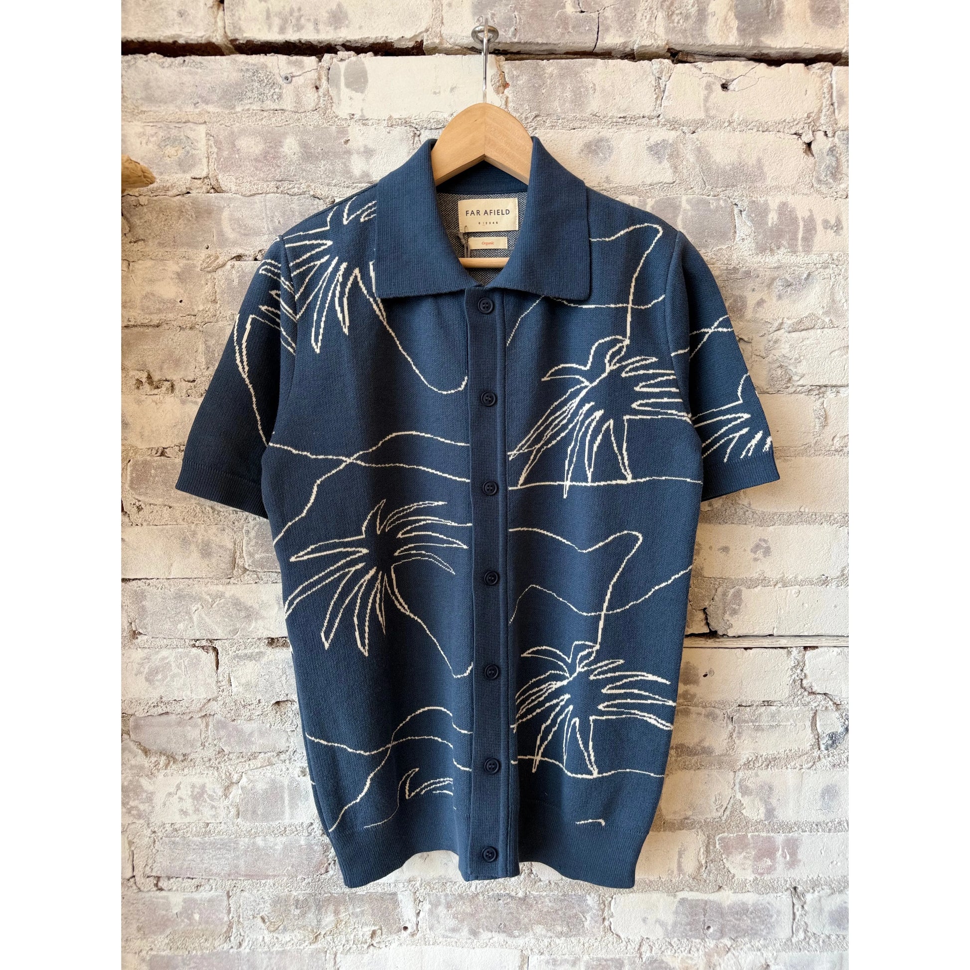 Men's Zig knitted shirt in faded navy and white palms by Far Afield, featuring a stylish, patterned knit design.