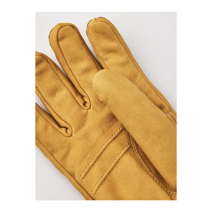 Men's Hestra Bergvik glove in tan leather, featuring a snug fit and detailed stitching for warmth and style.