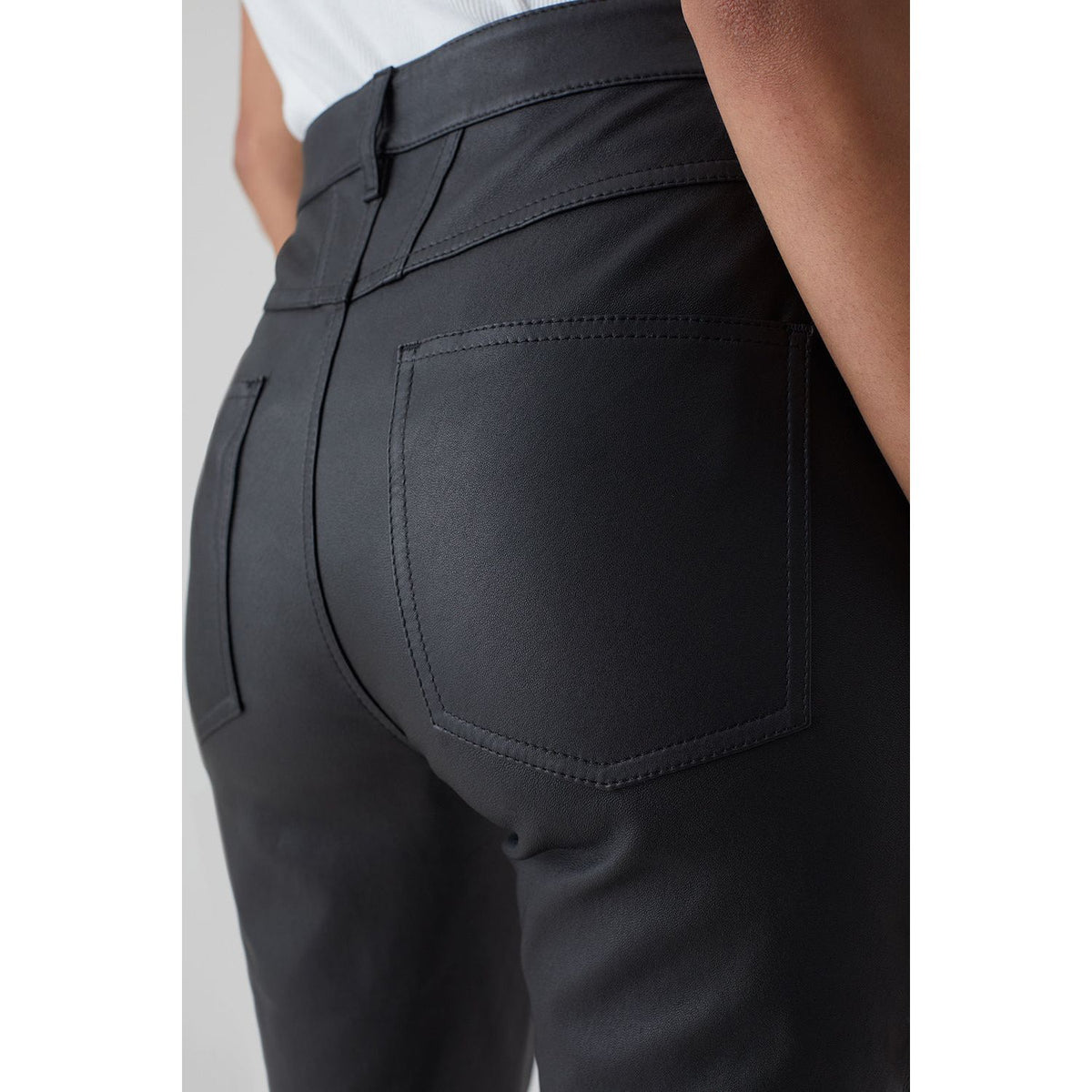 Black women's stretch leather skinny pants by Closed Women's, showcasing a fitted silhouette and sleek design.